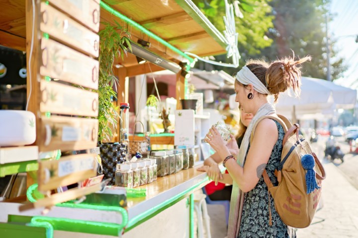 a woman buying cannabis