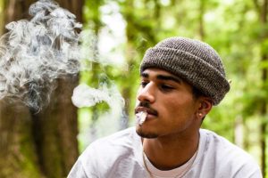a man smoking cannabis