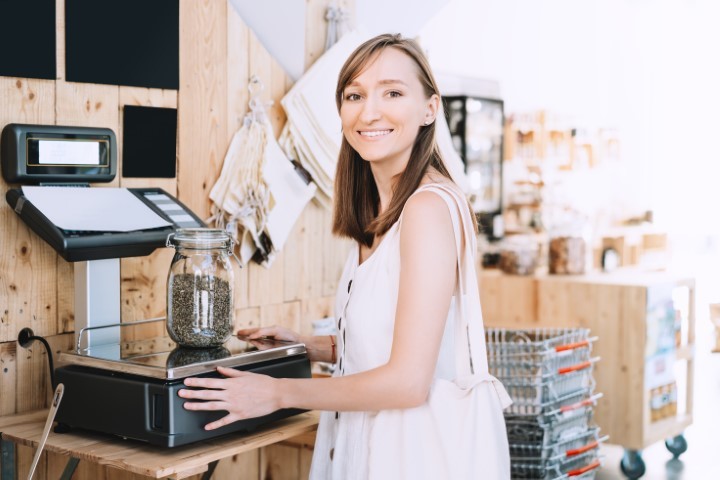 a lady standing near a cannabis